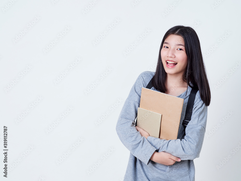 Girl student holding books with backpacks. Girl student holding books with backpacks.