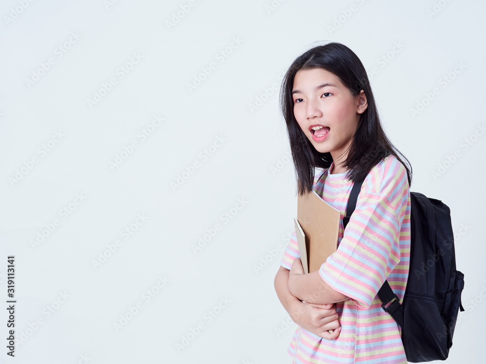 Girl student holding books with backpacks. Girl student holding books with backpacks.