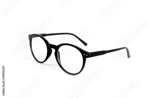 Unisex glasses with black plastic frames. With diopters for reading. Health, vision. Stylish accessories.