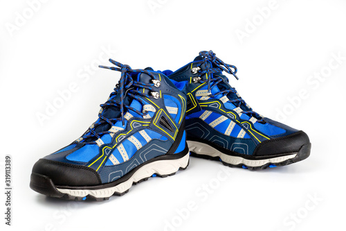Winter, sports, waterproof men’s boots in blue. On the lacing. Sports winter shoes. Comfort and activity.