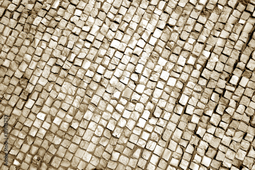 Stone pavement surface in brown tone.
