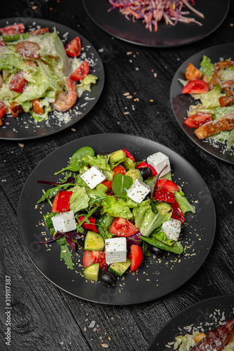Classic greek salad. Tasty, juicy, nutritious. Quick and easy to cook. Octoberfest party dinner. Festive table with delicious food