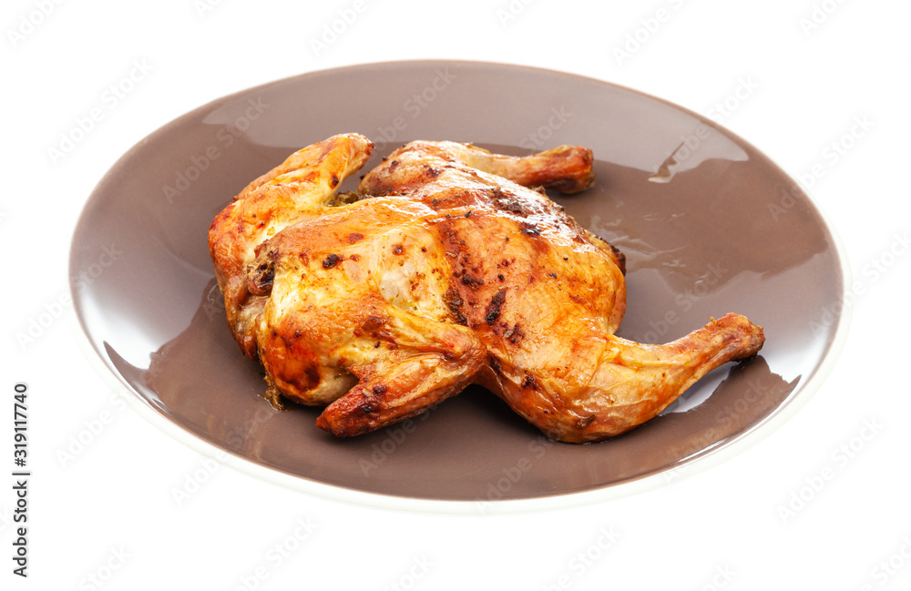 roasted whole flattened chicken on brown plate roasted whole flattened chicken on brown plate