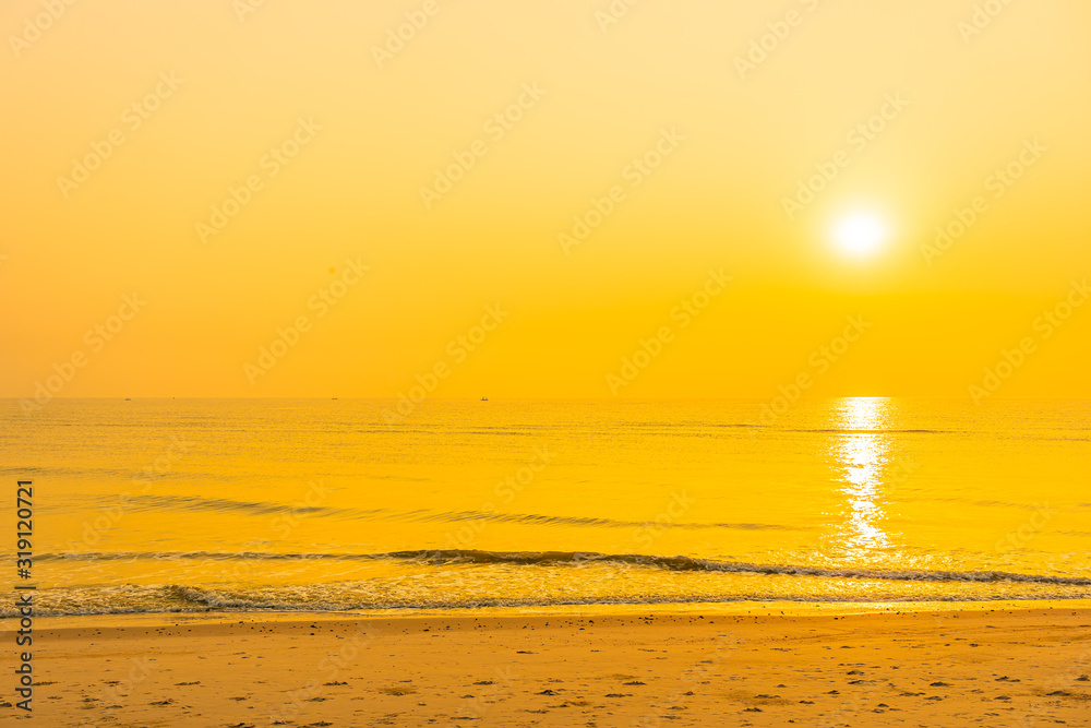 Beautiful tropical sea ocean beach at sunrise or sunset time Beautiful tropical sea ocean beach at sunrise or sunset time
