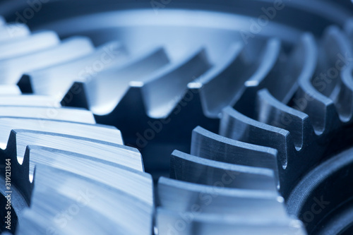 Three cog wheels working together in an engine