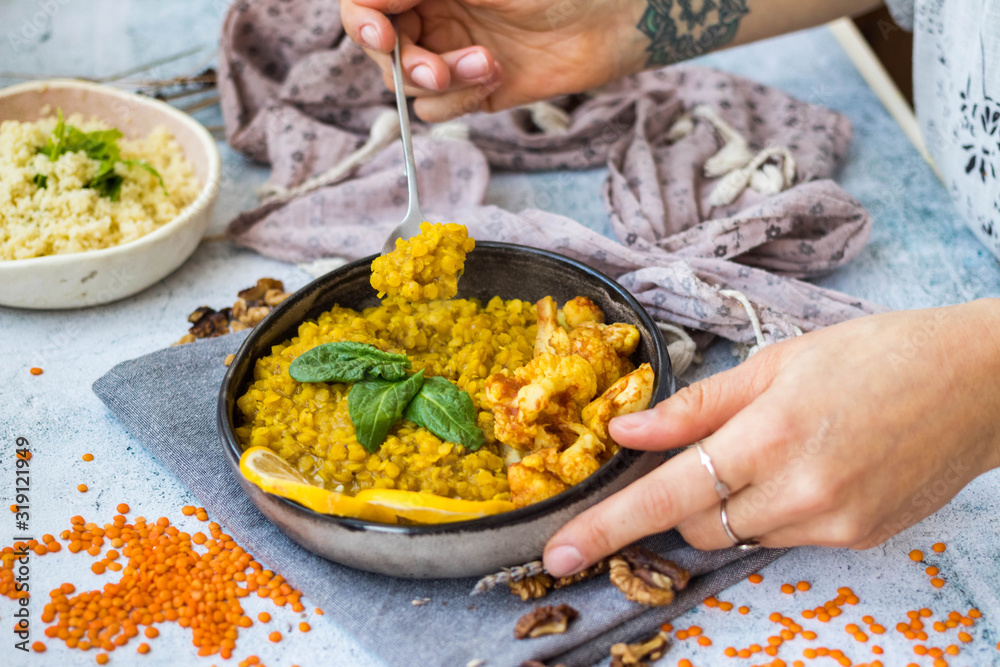 Lentil masala red dal cooked with cauliflower vegetables. Vegan Indian healthy food 