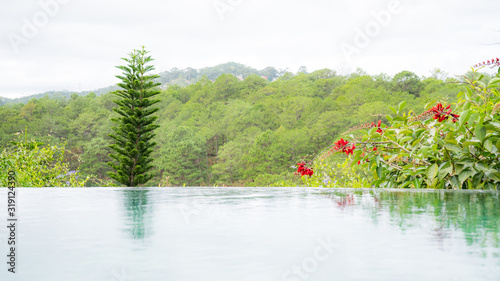 A swimming pool in the mountains with a beautiful view of the countryside of Dalat. © Hryhorii