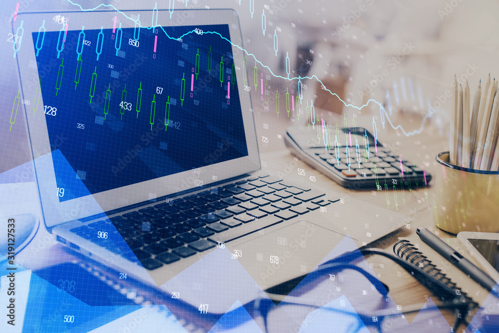Financial graph colorful drawing and table with computer on background. Double exposure. Concept of international markets. Financial graph colorful drawing and table with computer on background. Double exposure. Concept of international markets.