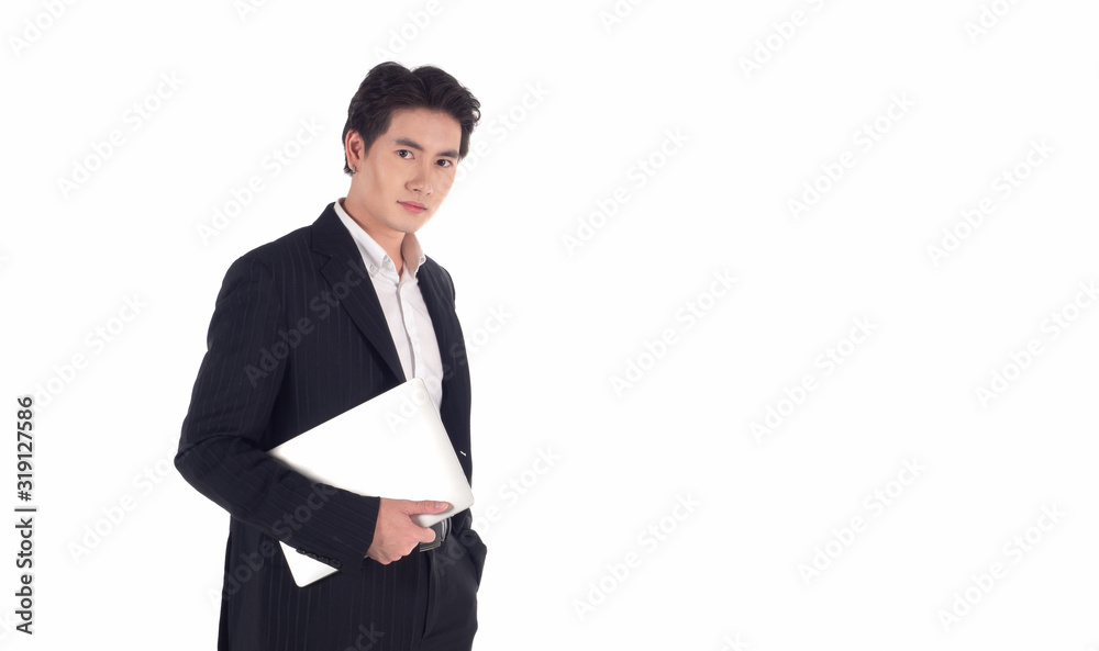 Portrait of a handsome Asian businessman, holding one hand in a gray computer and picking one at the camera and smiling on a white background,isolated Portrait of a handsome Asian businessman, holding one hand in a gray computer and picking one at the camera and smiling on a white background,isolated