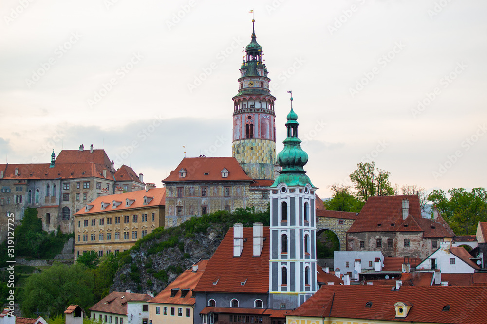 View of St. Jost Church at the foreground with Castle Tower at the background in Cesky Krumlov, Czech Republic
