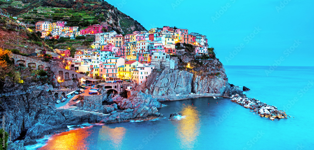 Beautiful magic colorful summer landscape on the coast of Manarola in Cinque Terre, Liguria, Italy at night. Exotic amazing places. Popular tourist atraction.