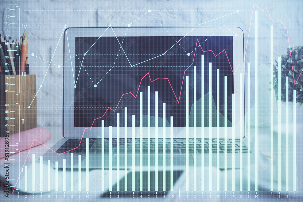 Financial graph colorful drawing and table with computer on background. Double exposure. Concept of international markets. Financial graph colorful drawing and table with computer on background. Double exposure. Concept of international markets.