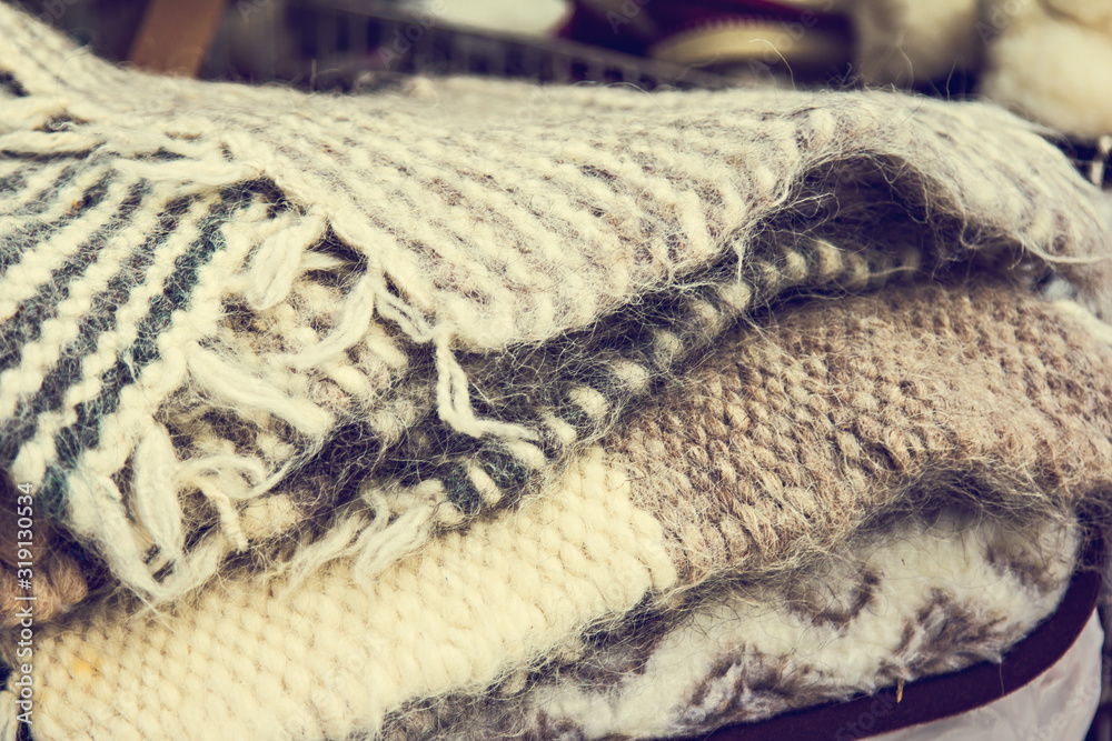 Fototapeta premium A pile of warm wool scarves. winter comfort, winter inspiration, still life