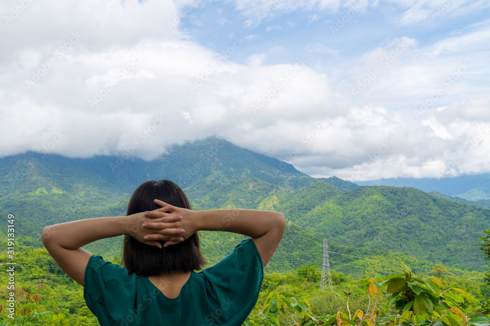 Naklejka premium young cute Japanese Asian hipster girl travelling at beautiful sky mountains scenery park hiking views at Phu Thap Boek Phetchabun Thailand guiding idea for female backpacker woman women backpacking