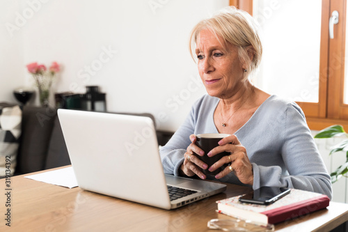 Adult woman focus on the laptop