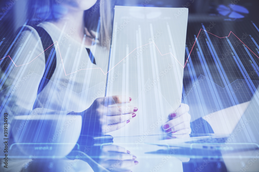 Double exposure of hands making notes with forex chart huds. Stock market concept. Double exposure of hands making notes with forex chart huds. Stock market concept.
