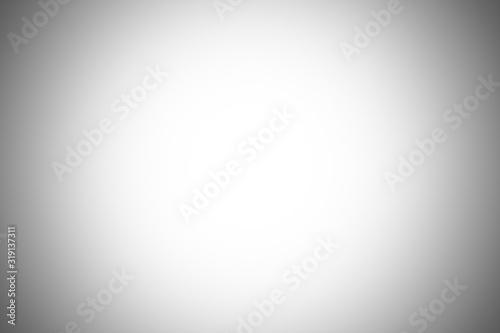 Abstract gray gradient wall background in empty room with bright white light blank studio