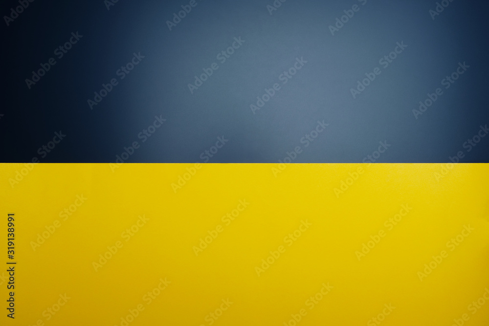Yellow paper on black table color with light spot for background. Yellow paper on black table color with light spot for background.