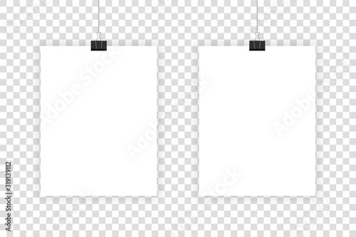 Two white realistic sheets hang on paper clips on a transparent background.