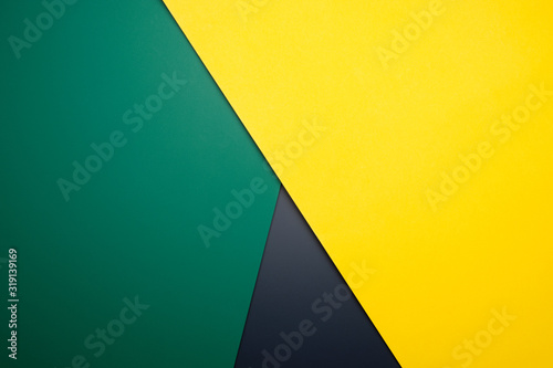 Triple color of Yellow, green and black crossing each other for background color. photo