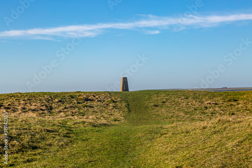 Fotografi A trig point on Firle Beacon in the South Downs, on a sunny winters day