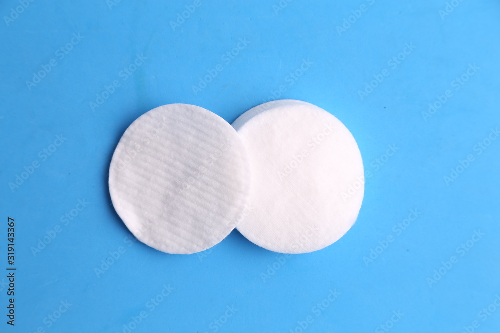 Cleansing cotton discs in colorful background