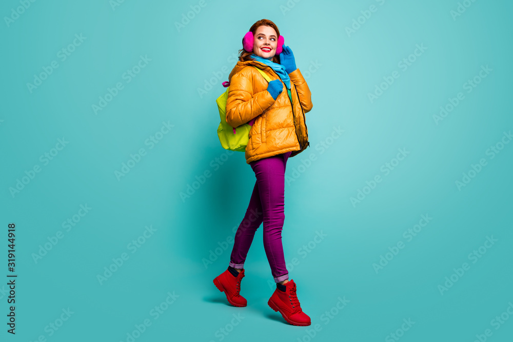 Full size photo of cheerful dreamy woman go walk winter lectures hold bag wear yellow pink purple red green jumper outfit isolated over teal color background Full size photo of cheerful dreamy woman go walk winter lectures hold bag wear yellow pink purple red green jumper outfit isolated over teal color background