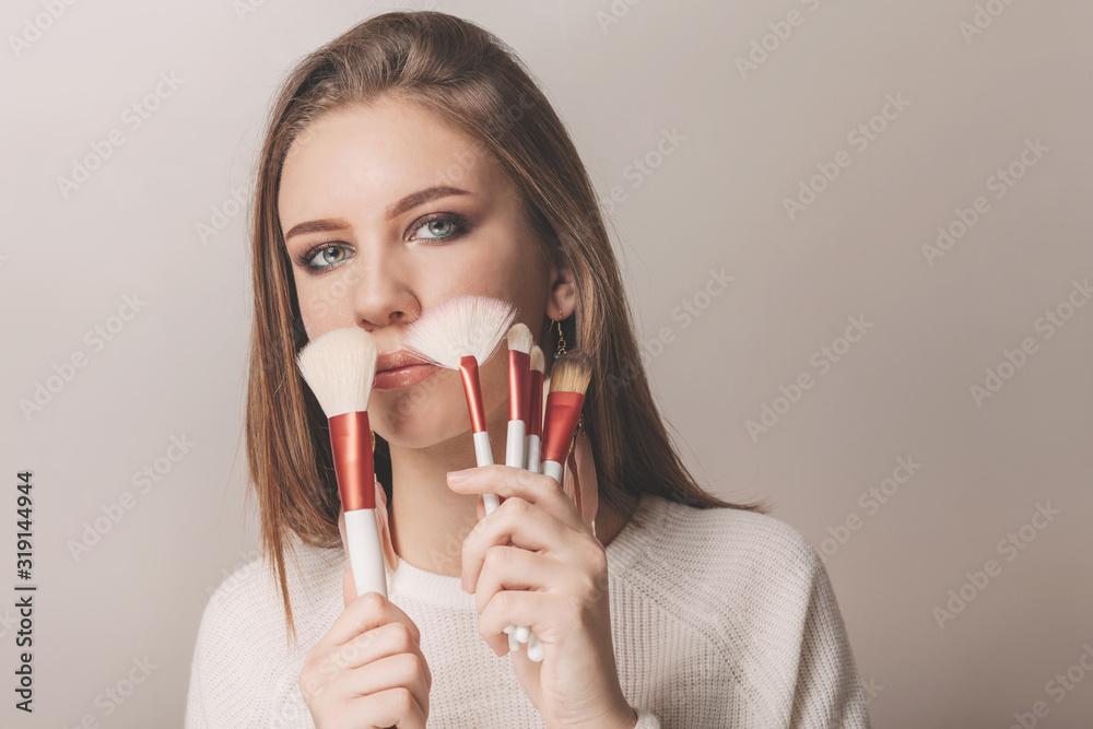 Portrait of teen model with stylish makeup holding contour brush Portrait of teen model with stylish makeup holding contour brush