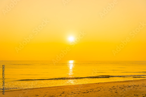 Beautiful tropical sea ocean beach at sunrise or sunset time