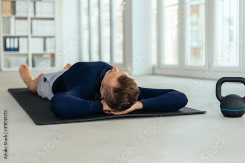 Man taking a break during his daily workout