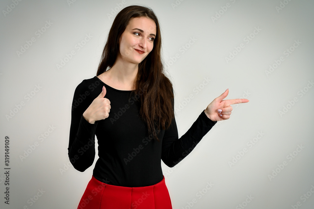 Concept girl talking in front of the camera with emotions. Photo of a pretty young brunette woman with a smile with good makeup on a white background. Concept girl talking in front of the camera with emotions. Photo of a pretty young brunette woman with a smile with good makeup on a white background.