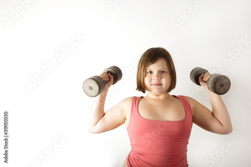 Chubby fat preteen girl with large dumbbells