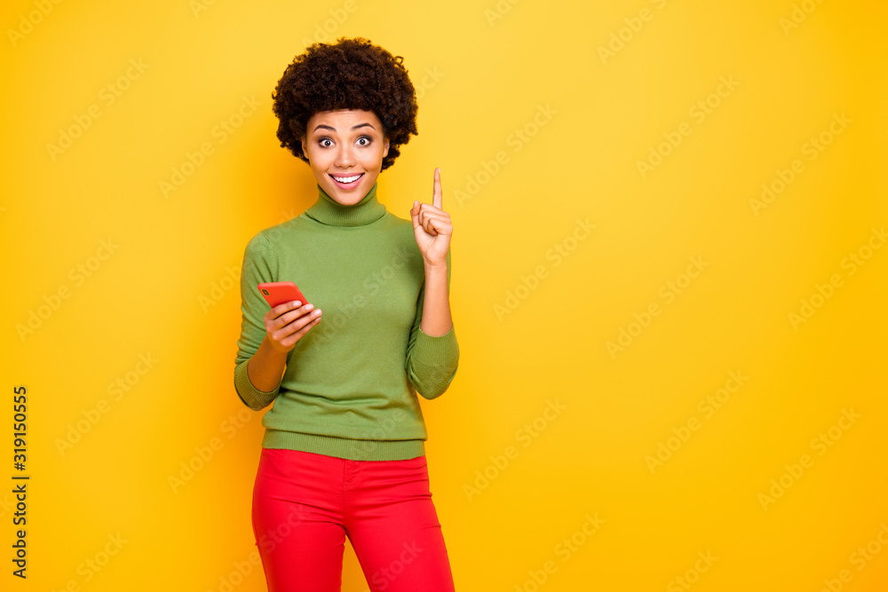 Photo of cheerful positive cute pretty girlfriend pointing up near empty space forefinger in red pants coming up with creative idea isolated vivid color background Photo of cheerful positive cute pretty girlfriend pointing up near empty space forefinger in red pants coming up with creative idea isolated vivid color background