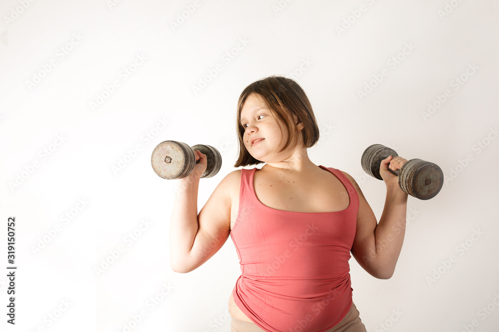 Chubby fat preteen girl with large dumbbells Chubby fat preteen girl with large dumbbells