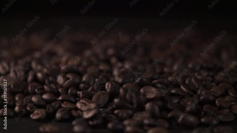 Falling coffee beans,Close up of seeds of coffee. Beautiful seeds of coffee.