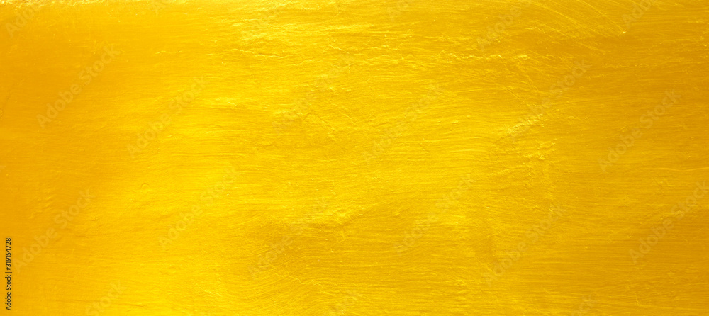 Naklejka premium Golden cement wall background