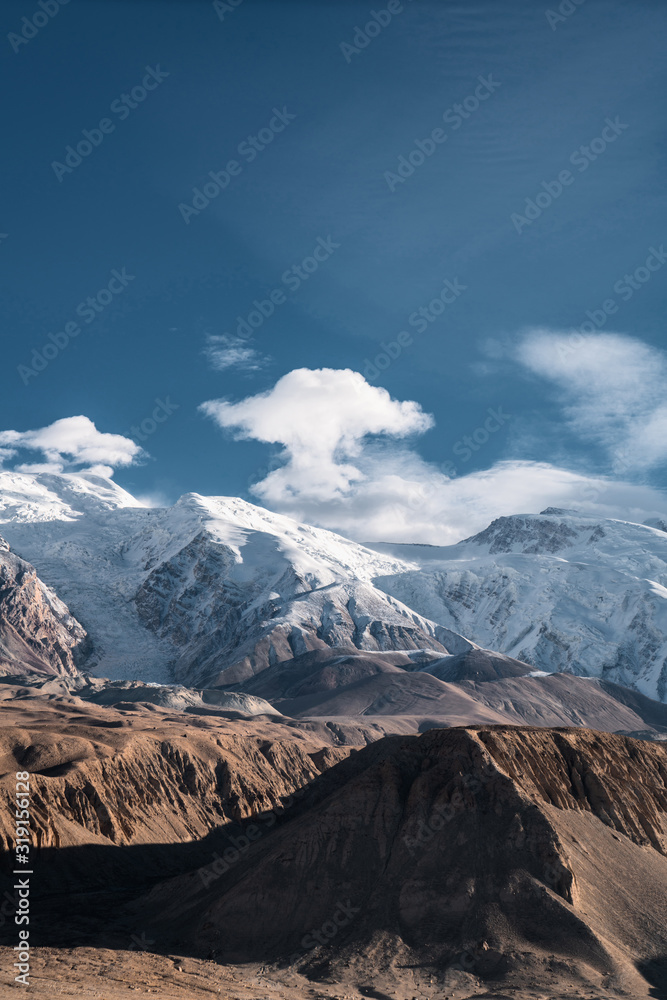 Fototapeta premium Snow mountain and rocky canyon located in Xinjiang China pamir plateau.