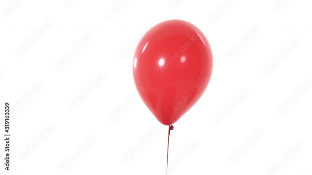 Red balloon appearing in camera view. Isolated, on white background. Valentine's day gift concept Red balloon appearing in camera view. Isolated, on white background. Valentine's day gift concept