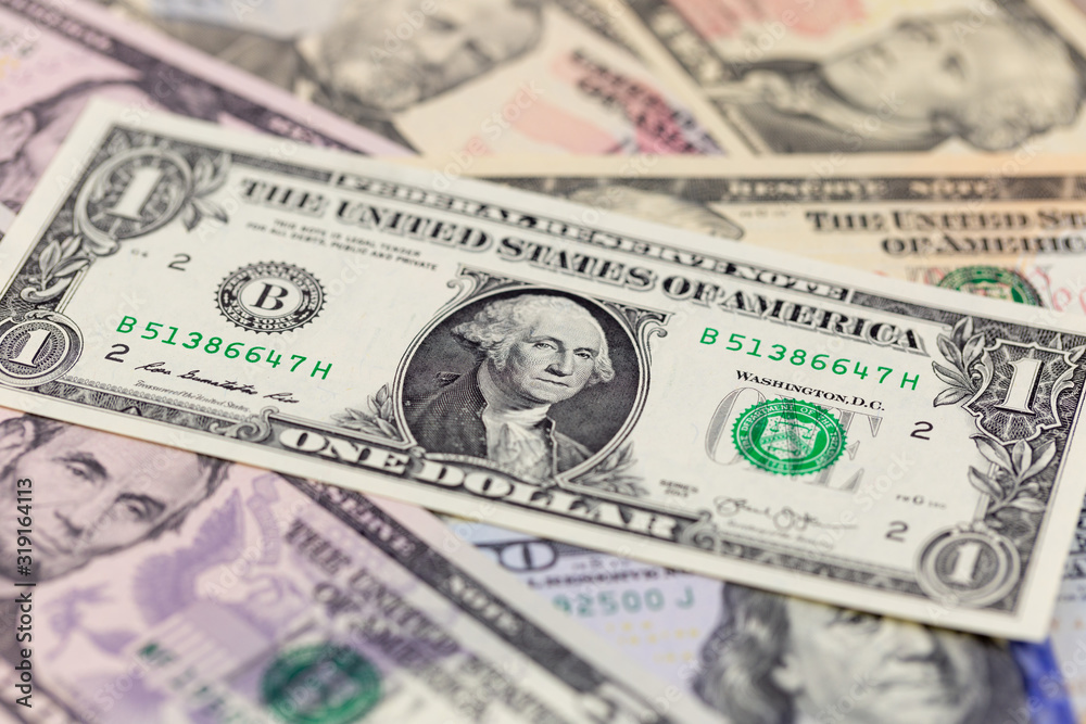 One dollar bill on american banknotes, business background One dollar bill on american banknotes, business background