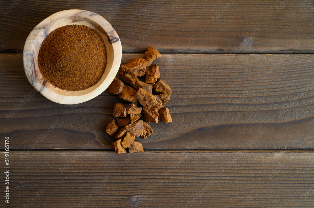 chaga tea mushroom from birch tree using for healing tea or coffee in folk medicine. ground powder chaga tea mushroom from birch tree using for healing tea or coffee in folk medicine. ground powder