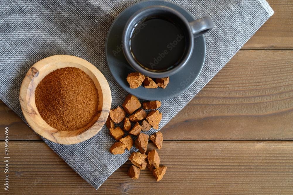 chaga tea mushroom from birch tree using for healing tea or coffee in folk medicine. ground powder chaga tea mushroom from birch tree using for healing tea or coffee in folk medicine. ground powder