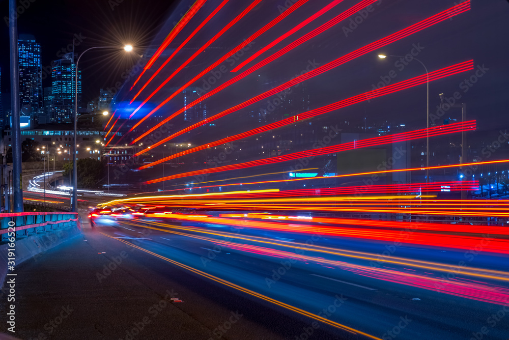 Obraz premium Long exposure picture of a night traffic through the Anzac Bridge in Sydney