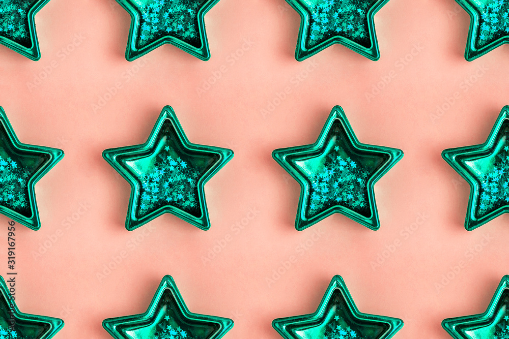Seamless pattern from five pointed mint metallic star on pink surface Seamless pattern from five pointed mint metallic star on pink surface