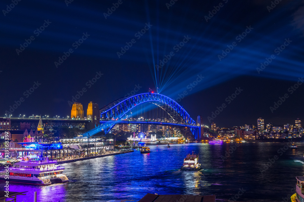 The Sydney Harbour Bridge and the city at night during Vivid Annual Festival of light