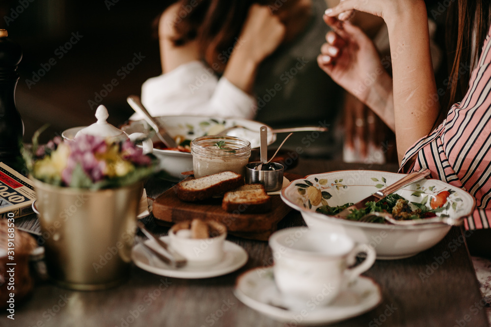 Two girls have lunch in a restaurant Two girls have lunch in a restaurant