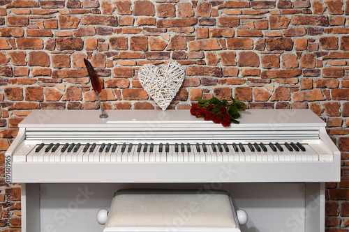 A piano, a heart and a bouquet of roses