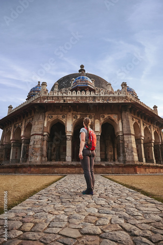 Tourist woman is walking to Isa Khan's Tomb in Humayun's Tomb complex, New Delhi, India. photo