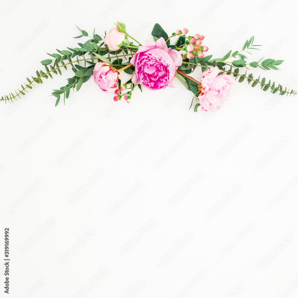 Floral composition of pink peony flowers and eucalyptus on white background. Flat lay
