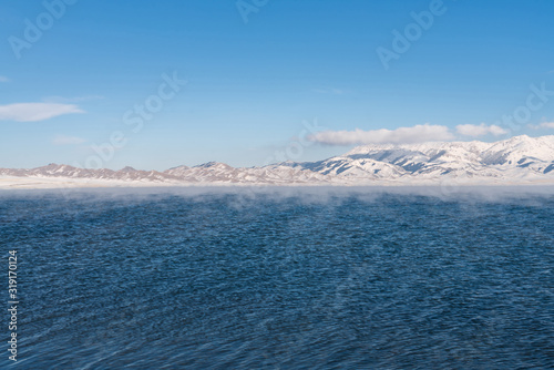 Blue lake with peaceful wave loacted in Xinjiang China named Sayram(sailimu). Winter season.