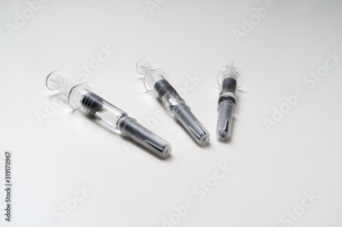 Generic prefilled vaccine syringes. Close-up studio shot.